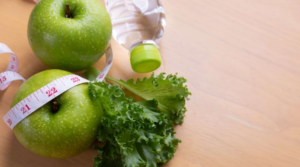 tape measure and water and diet food, weight loss and detox concept.