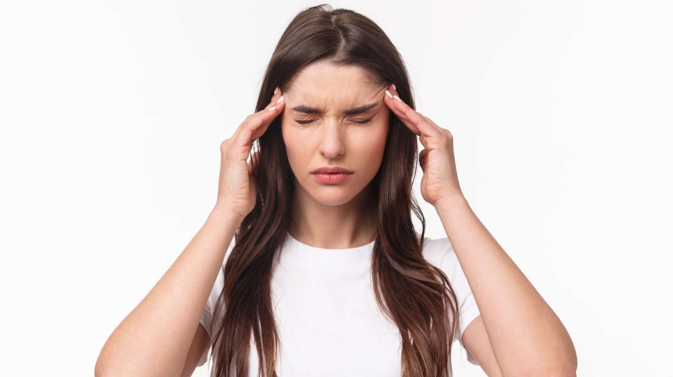 Close-up portrait of woman trying calm down, feeling migraine or terrible headache, suffer pain, massaging temples frowning and close eyes, controlling emotions, white background.